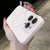 Light pink liquid silicone iPhone case showing the smooth matte finish and raised camera guard.