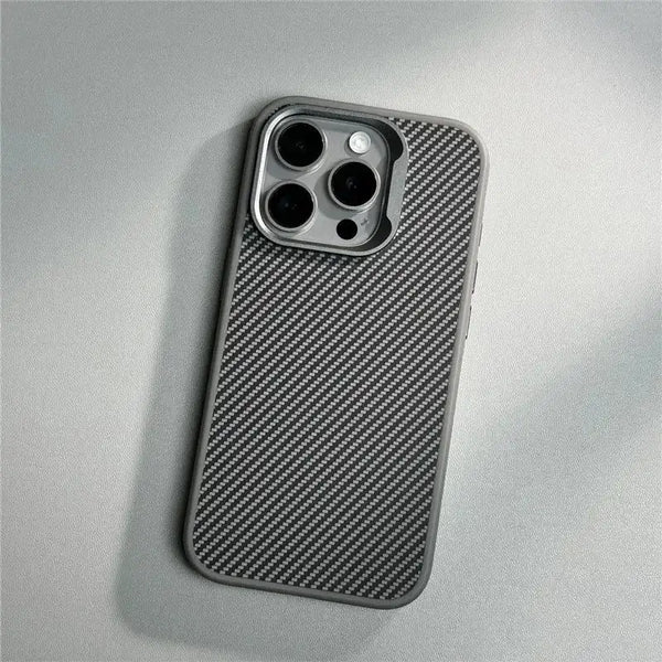 Grey textured iPhone case laid flat, showing the slim profile and carbon-style surface finish