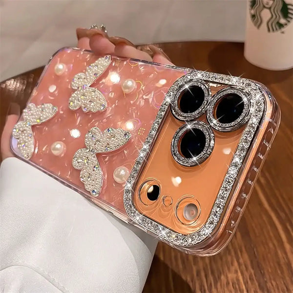 Pink translucent butterfly iPhone case showing the raised camera edge and glossy sparkle finish.
