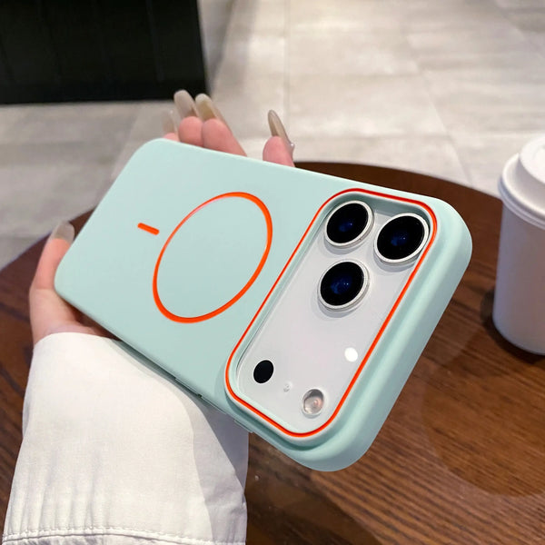 Mint matte iPhone case in hand with orange magnetic ring and raised camera frame on the back.