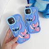 Two blue Stitch silicone iPhone cases displayed together on a soft white surface, highlighting the playful finish.