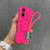 Bright pink matte iPhone case with integrated strap, shown in hand.