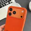 Close-up of orange woven iPhone case with raised camera protection and textured surface