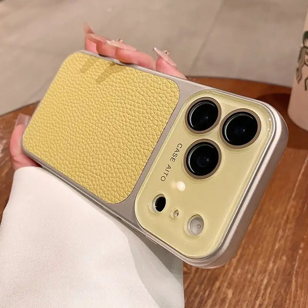 Yellow litchi leather iPhone case with half-wrapped PC frame on a tabletop