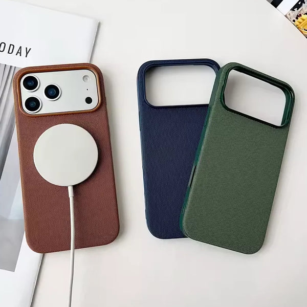 Three woven iPhone cases in brown blue and green with magnetic charging puck on one case