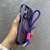 Purple armor iPhone case with magnetic ring stand and camera protection shown in hand