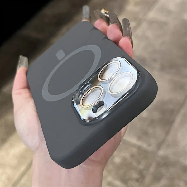 Black liquid silicone MagSafe case displayed in hand with a clean minimalist profile and camera module protection.