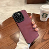 Plum matte silicone iPhone case with premium soft-touch finish in hand