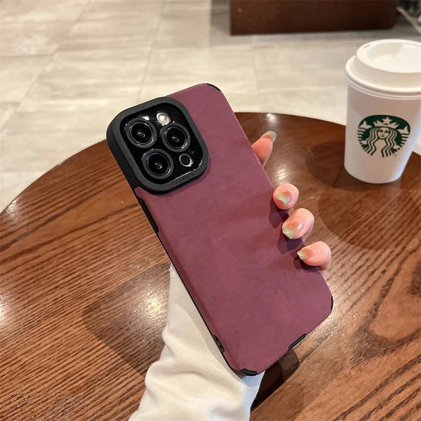 Plum matte silicone iPhone case with premium soft-touch finish in hand