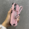 Pink armor iPhone case with lanyard and sliding camera cover shown in hand