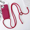 Dark green crossbody iPhone case with lanyard and card holder shown on a desk