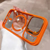 Orange translucent iPhone case showing the open frame, magnetic ring, and raised camera area