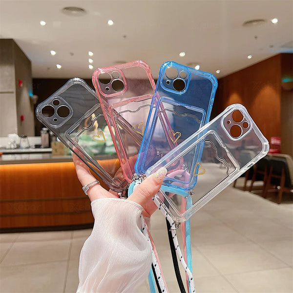Clear iPhone case with card pocket and crossbody lanyard shown in hand