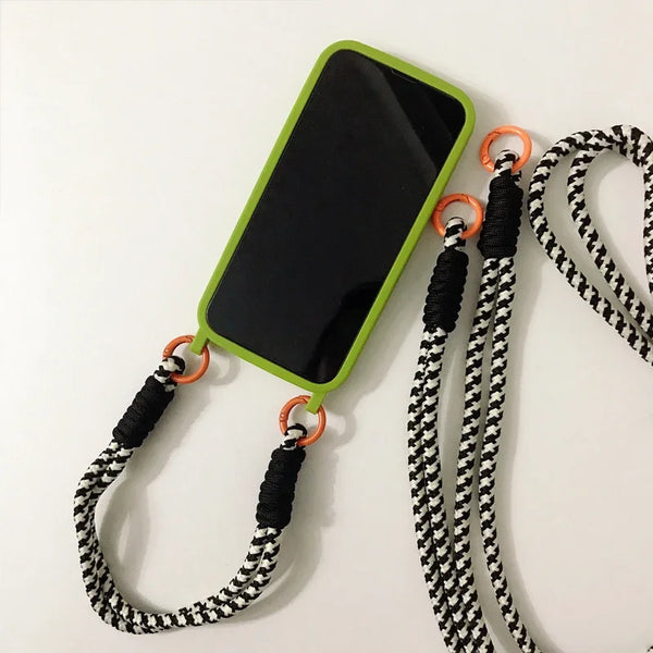 Green crossbody iPhone case with long lanyard laid flat to show the full set.
