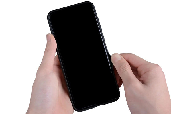 Slim half-wrapped leather iPhone case shown in hand for everyday grip