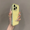 Yellow clear iPhone case with glossy transparent finish held in hand