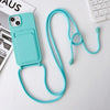 Light aqua iPhone case with crossbody strap and built-in card holder on a white desk.