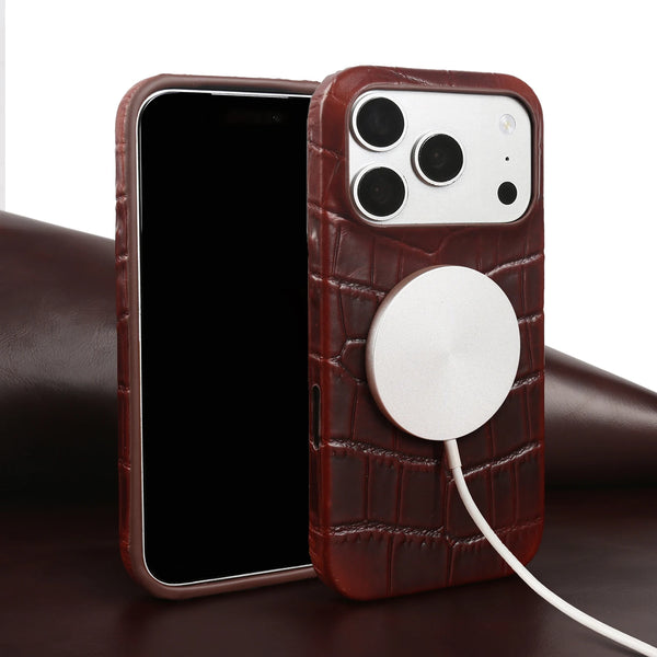 Brown leather iPhone case shown with magnetic charger attached on a white background
