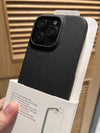 Close-up of the black woven iPhone case emphasizing the matte grip and premium texture.