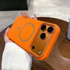 Orange matte iPhone case in hand showing the raised camera protection and magnetic ring design.