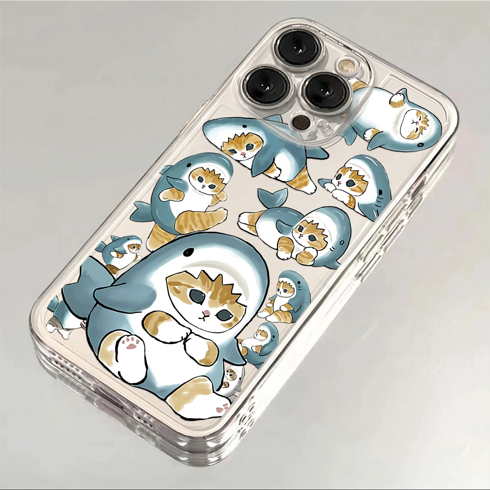 Pastel transparent iPhone case with cute cats, clear back, and camera-safe raised edge.
