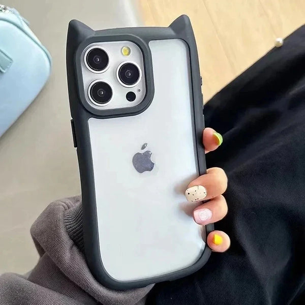Black cat-ear silicone iPhone case with transparent back held in hand