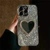 Close-up of silver heart mirror iPhone case with shimmering glitter finish