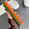 Blue woven iPhone case charging wirelessly with a clean slim profile