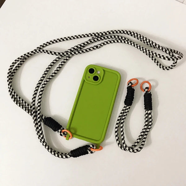 Green iPhone case with matching strap accessories arranged for a coordinated look.