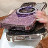 Sparkly magnetic-ready iPhone case resting on a table with the holder ring open.