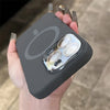 Black liquid silicone MagSafe case displayed in hand with a clean minimalist profile and camera module protection.
