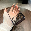 Close-up of a clear sparkling iPhone case showing the glossy transparent back and plated edge.