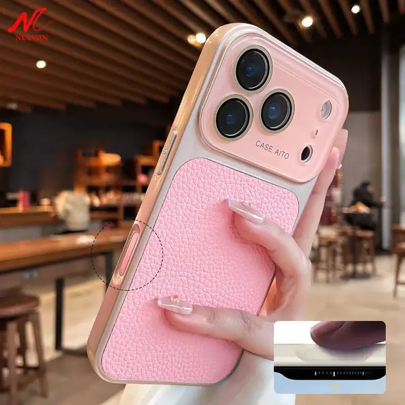 Pink litchi leather armor iPhone case with raised camera area held in hand