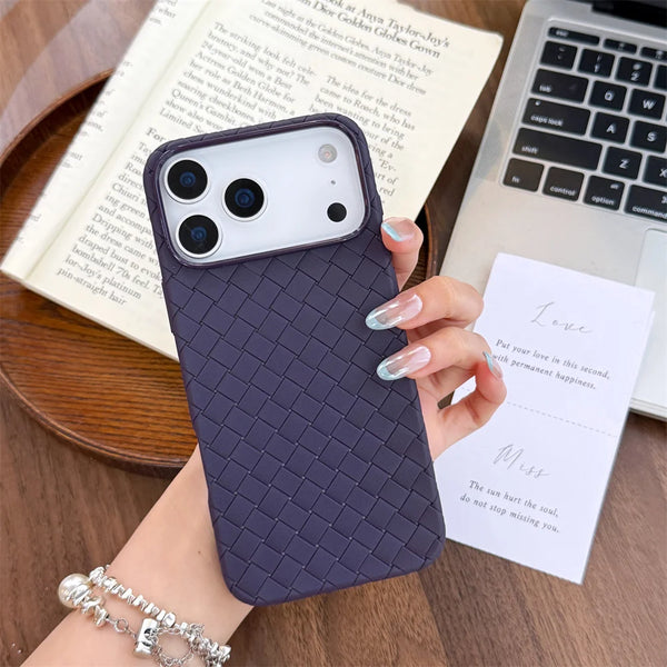 Close-up of a purple braided iPhone case showing the raised camera edge and woven texture