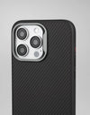 Back view of black carbon-texture iPhone case showing triple-camera cutout and clean side profile