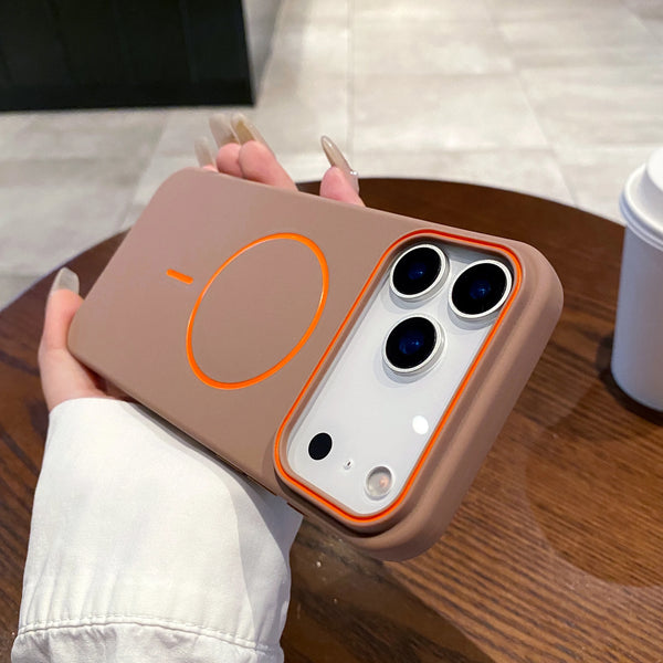 Brown matte iPhone case in hand highlighting the slim fit and raised camera protection.