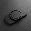Matte black ring grip holder for men on dark slate background