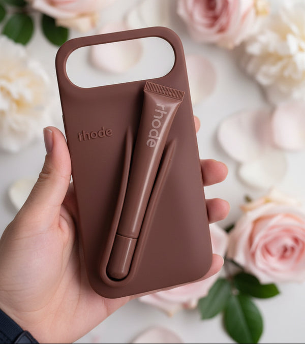 Trendora light gray matte silicone iPhone case with built-in lip gloss holder, raised camera bumper, and lanyard loop.